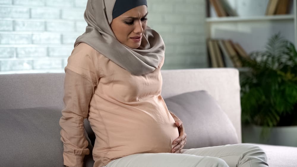 Hijabi woman about to give birth in labor