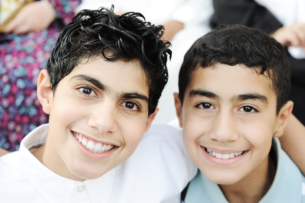 Two teen boys smiling